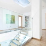 Modern,And,Bright,Hallway,With,Glass,Staircase,,Horizontal